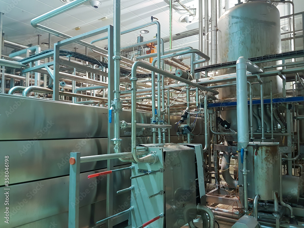 Madrid, Spain 06/14/2019: aluminum pipes and conduits of a food factory Madrid, Spain 06/14/2019: aluminum pipes and conduits of a food factory