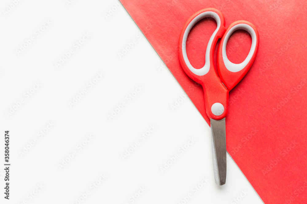 red handle stationery scissors, scissors on a white background red handle stationery scissors, scissors on a white background