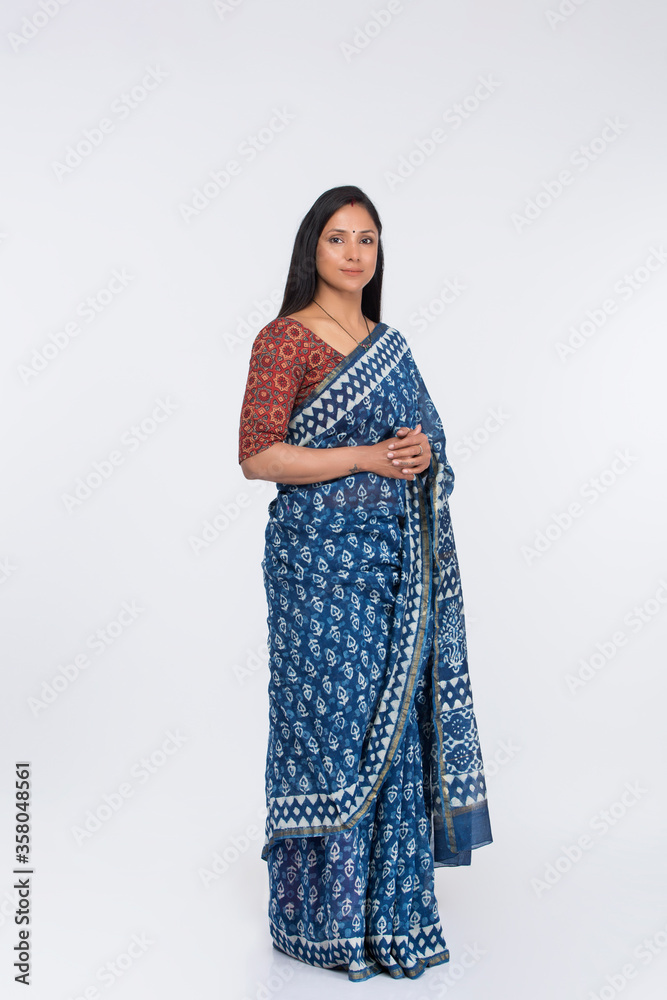 Beautiful young woman posing in traditional saree Beautiful young woman posing in traditional saree