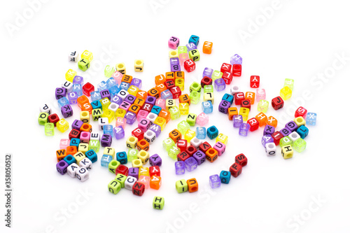 Alphabet color bead on white background.