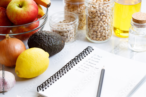 Culinary, cooking and healthy food concept. Food ingredients on table with notebook