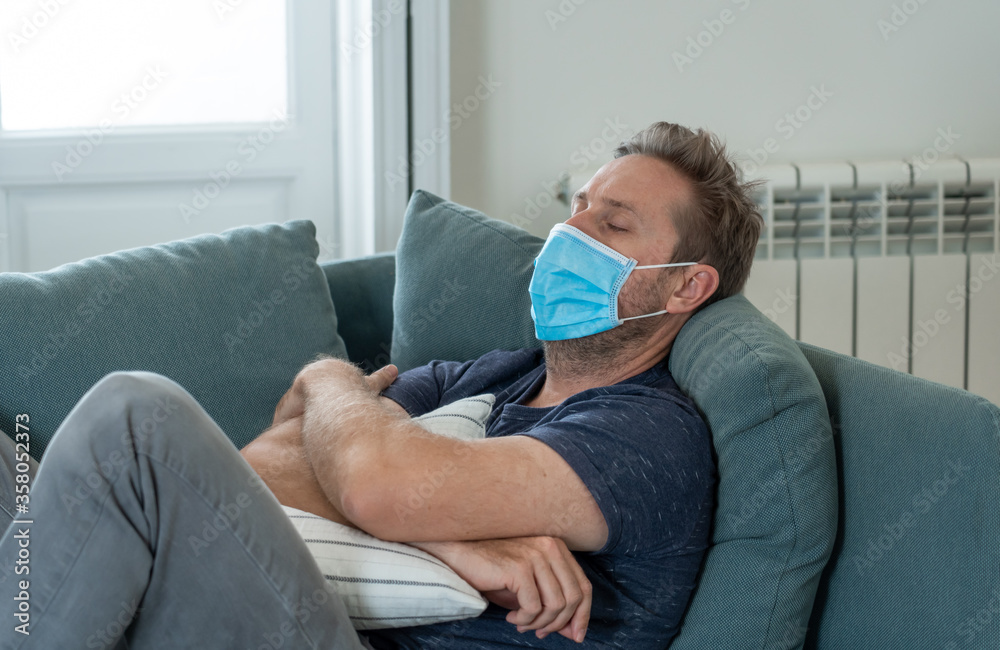 Lonely man suffering from depression at home during coronavirus lockdown and social distancing Lonely man suffering from depression at home during coronavirus lockdown and social distancing