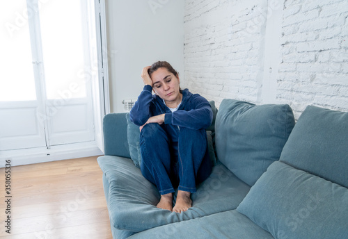 Wallpaper Mural Young sad woman suffering from depression feeling lonely and hopeless isolated at home Torontodigital.ca