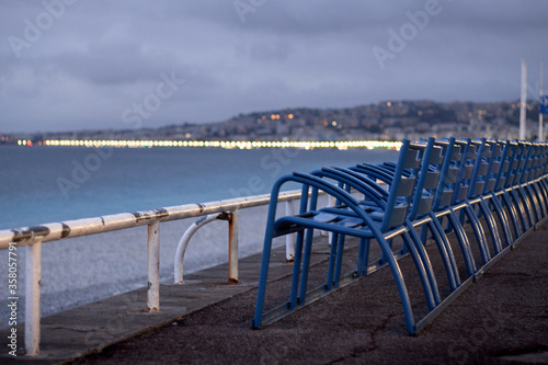 French Riviera landscape from Promenade des Anglais with blue chairs in Nice  France