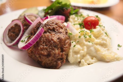 Photography Traditional German meatballs (klopse) served with potato salad