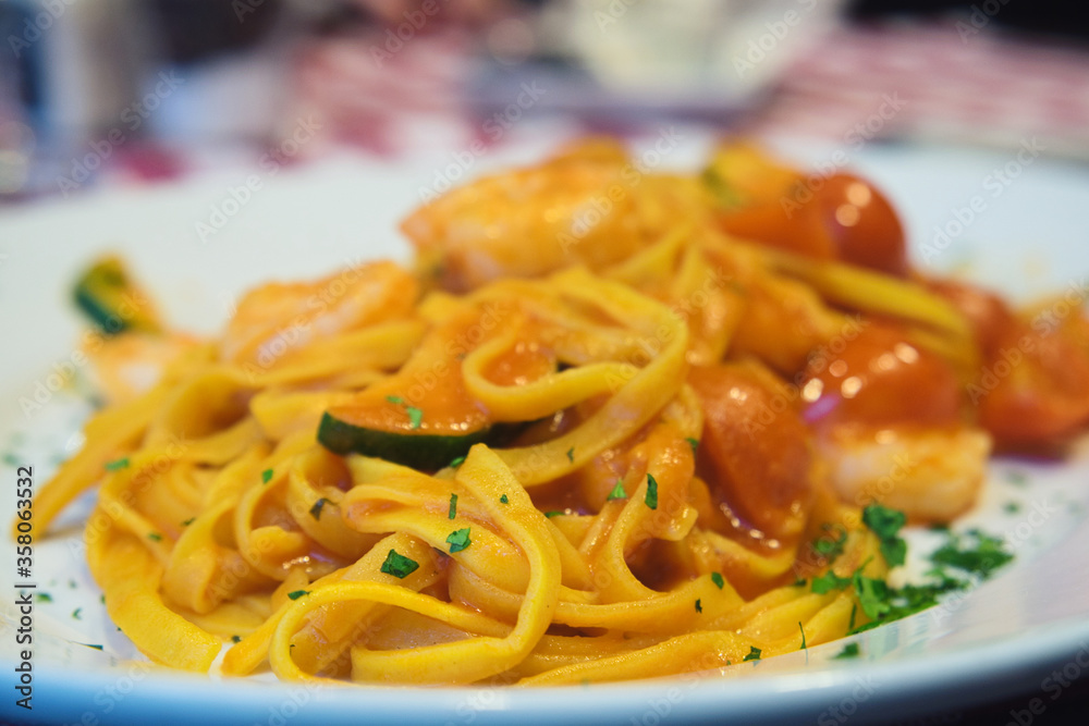 Delicious homemade Italian pasta with shrimps and parmesan cheese Delicious homemade Italian pasta with shrimps and parmesan cheese