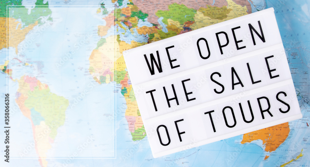 Message plate we open the sale of tours on a map background.Top view. Banner.Concept end pandemic,open travel