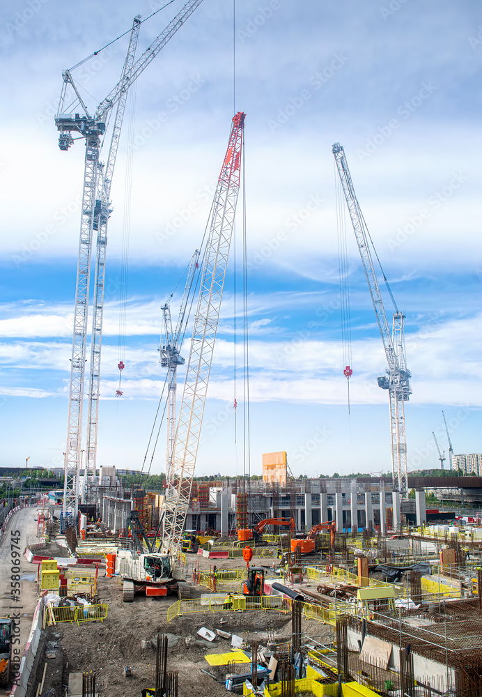 Construction building site with cranes in London, UK