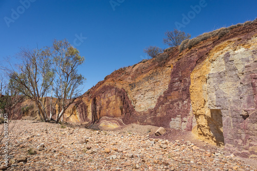 Ochre mine, used by aboriginal Australian as raw material for paintings and ceremonial body decoration. Gravel on the floor. Ochre Pits, MacDonnell ranges, Northern Territory NT, Australia, Oceania photo