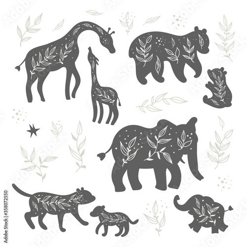 Set of isolated black and white silhouettes of wild animals and their cubs