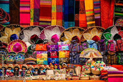 Colorful mexican souvenirs at the market stall at Chichen-Itza archaeological site.