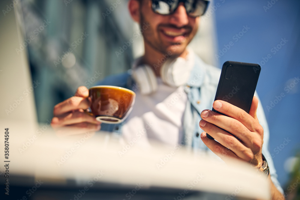 Focused photo on male hand that holding telephone