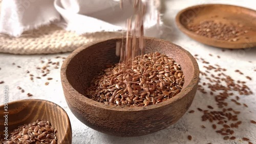Brown flax seeds in a bowl close up