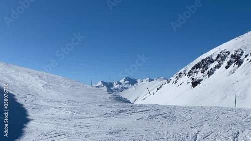 Ski trials on slope mountains. photo