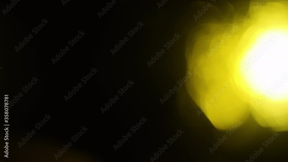 Slow Motion Long Shot of Abstract Bokeh Yellow Light Moving. 4k Footage of Light Leak. Slow Motion Long Shot of Abstract Bokeh Yellow Light Moving. 4k Footage of Light Leak.