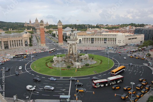 BARCELONA / SPAIN - 19/08/2014 summer day rooftop view of the Placa d'Espanya square with the fountain, the Venetian towers and the traffic on the roundabout