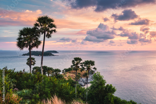 Viewpoint Laem Promthep cape with colorful sky and sugar palm tree in the sunset at Phuket
