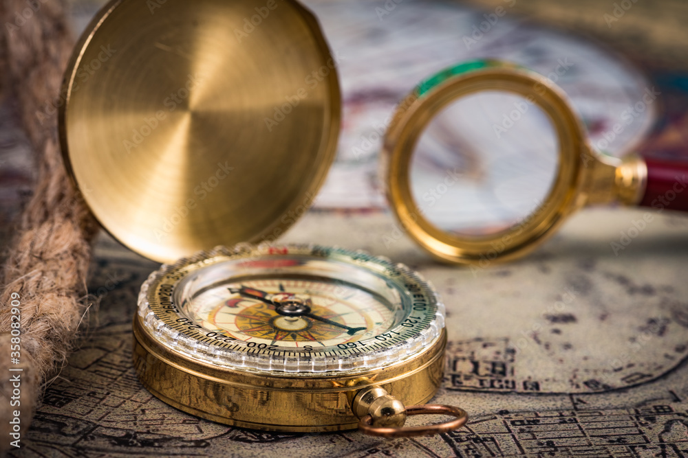 compass and magnifying glass compass and magnifying glass