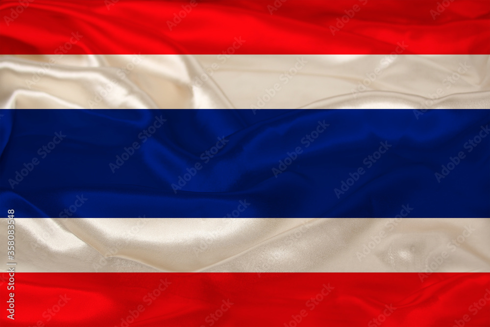 Naklejka premium photo of the beautiful colored national flag of the modern state of Thailand on textured fabric, concept of tourism, emigration, economics and politics, closeup