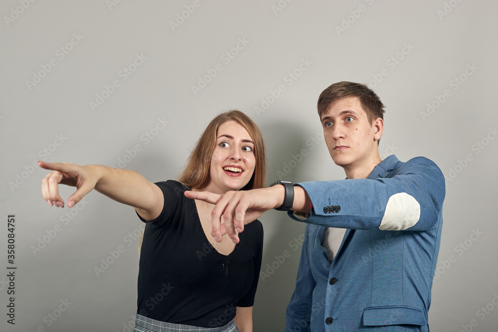 Hand pointer with forefinger pointing forward. Index finger to show direction. Means choosing, introducing too. Indicating towards. Young attractive couple boyfriend girlfriend two people Hand pointer with forefinger pointing forward. Index finger to show direction. Means choosing, introducing too. Indicating towards. Young attractive couple boyfriend girlfriend two people