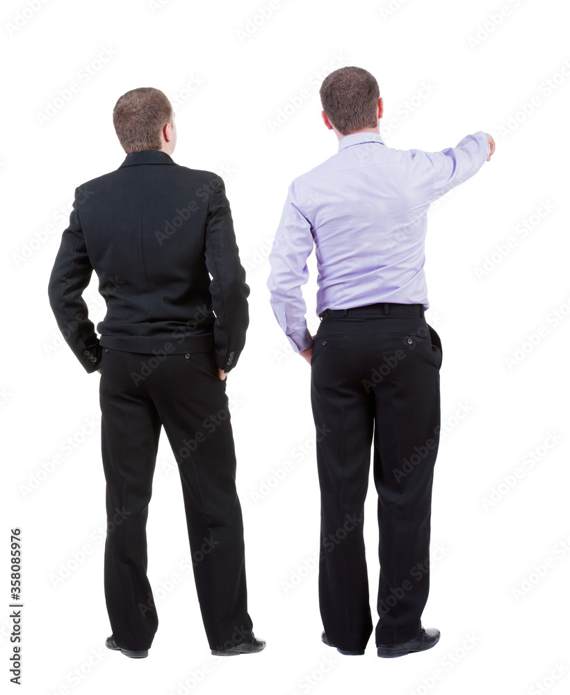 Back view of two business men in suit pointing. Back view of two business men in suit pointing.