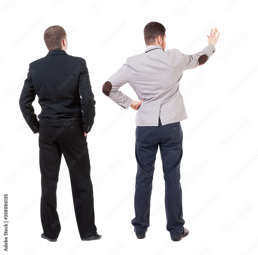 Back view of two business men in suit pointing. Back view of two business men in suit pointing.