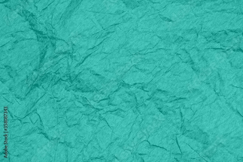 Teal wrinkled textured paper background