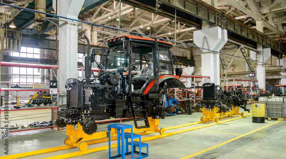 Fototapeta premium tractor Assembly on the conveyor, engine, spare parts