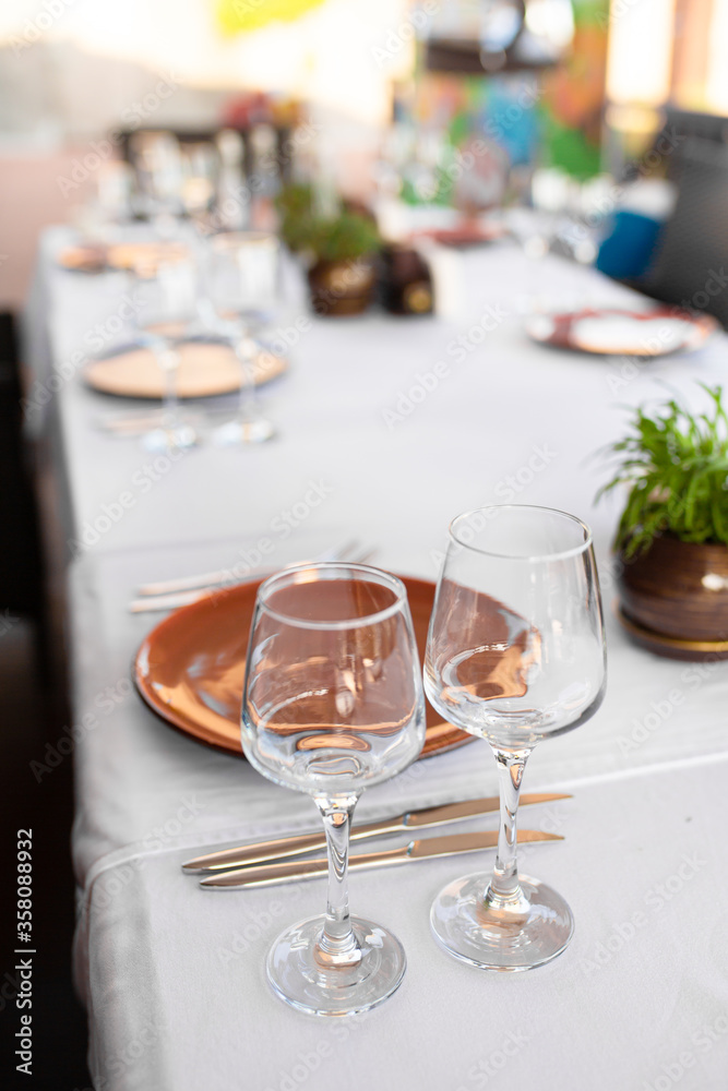 Stylish table setting in an open-air restaurant.