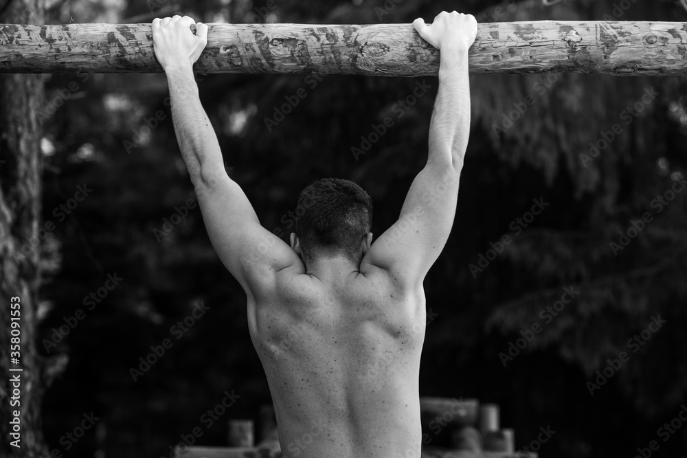 Young guys doing exercise in the nature. Young guys doing exercise in the nature.