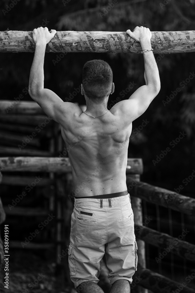 Young guys doing exercise in the nature. Young guys doing exercise in the nature.