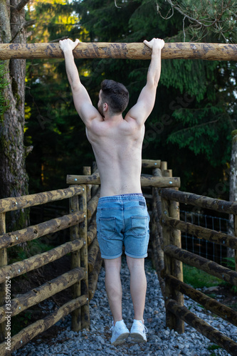 Young guys doing exercise in the nature.