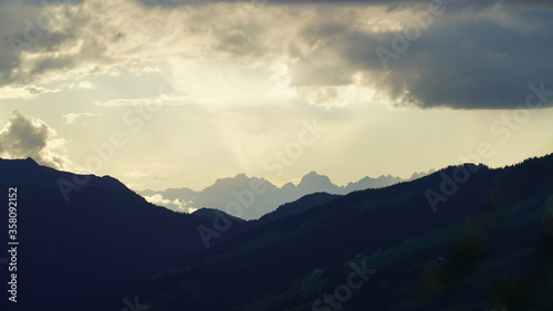 beautiful sunset on the mountains with clouds and sunligth and view to the alps