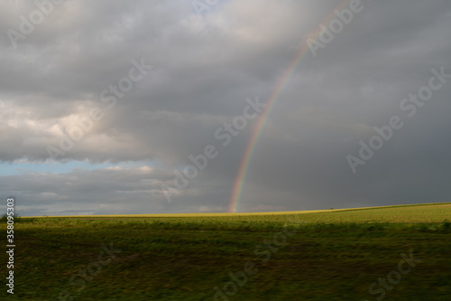 Cloudy sky after the rain. Rainbow. Natural seasonal, weather, climate, countryside beauty concept and background scene. Ecology © Ivanna