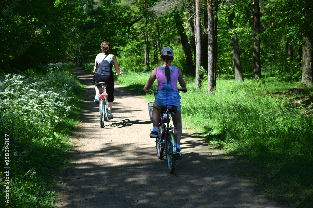 Fototapeta premium young couple riding bikes