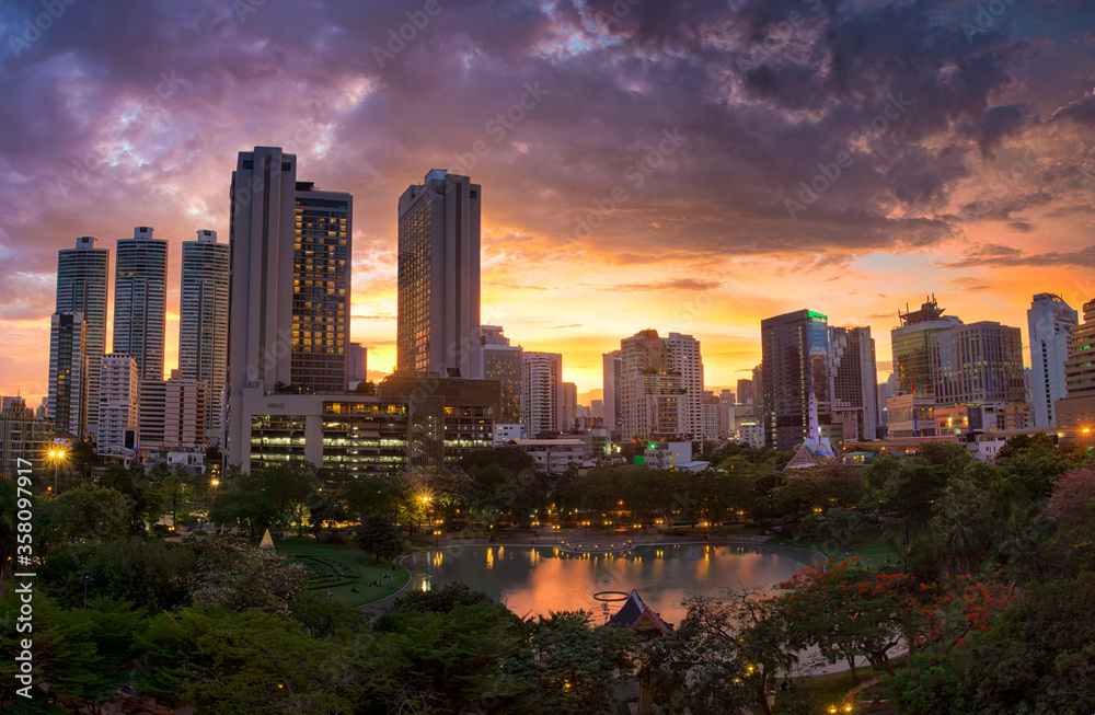 Beautiful sunset behind business town in Bangkok