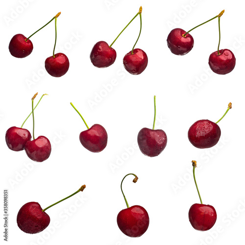 Juicy and bright cherry fruits with water drops isolated on a white background