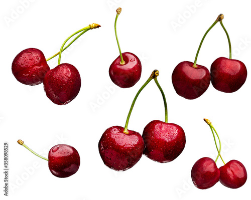 Juicy and bright cherry fruits with water drops isolated on a white background