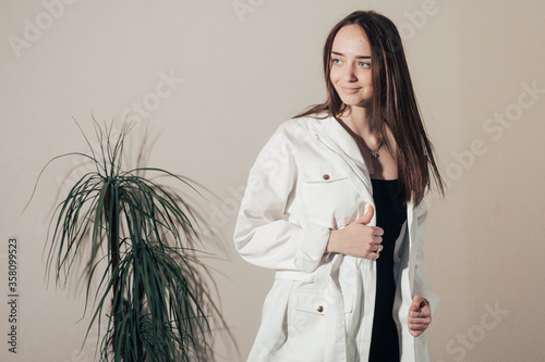 black dress and white coat 