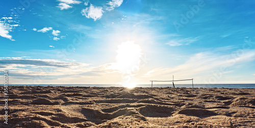 Beaytiful summer beach with sun shine on blue sky background.