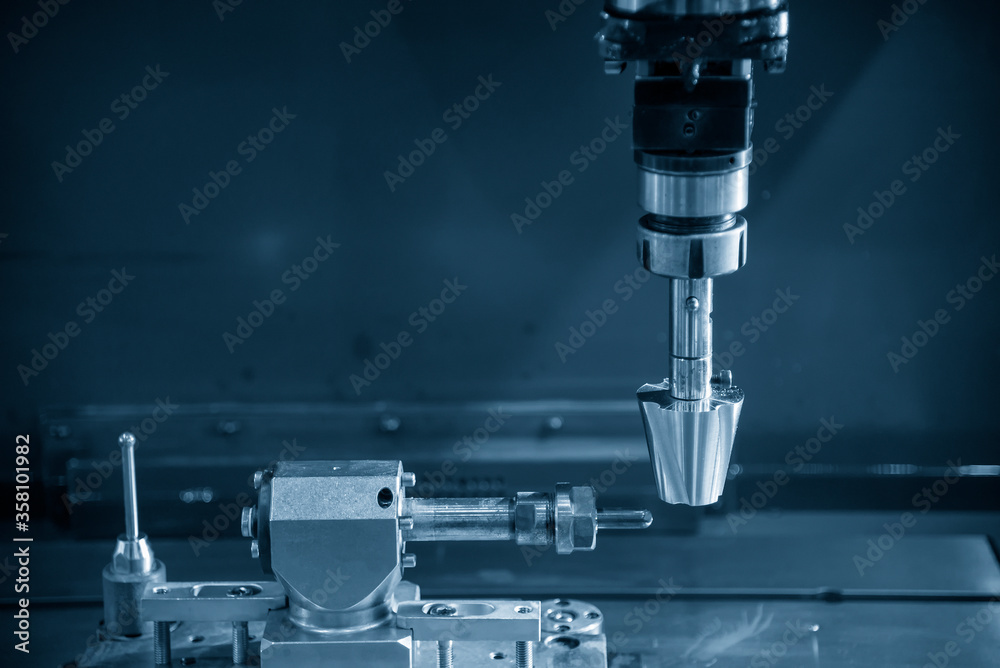 The 4-axis EDM machine operation in the light blue scene. The hi-technology mold and die manufacturing process by sinker EDM machine . The 4-axis EDM machine operation in the light blue scene. The hi-technology mold and die manufacturing process by sinker EDM machine .