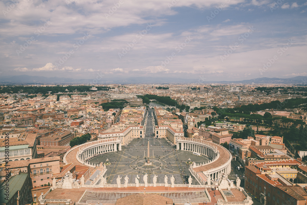 Panoramic view on the St. Peter's square and city of Rome from Papal Basilica