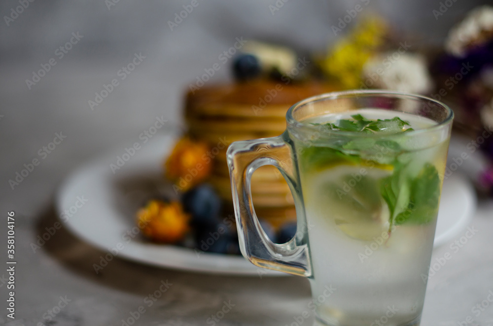 pancakes with honey, berries and cold mojito pancakes with honey, berries and cold mojito