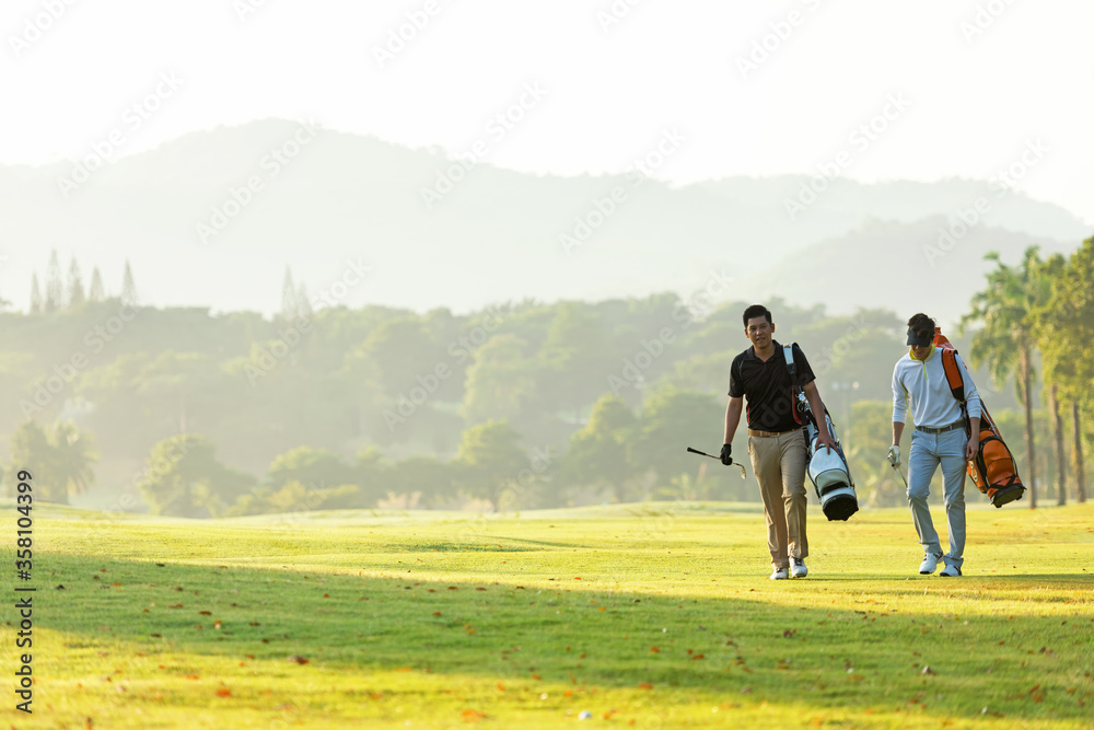 Group golf professional Golfer asian man walking in fairway with bag golf at golf  club.  