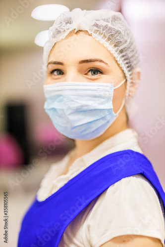 asian woman patient look to you with facial mask in hospital