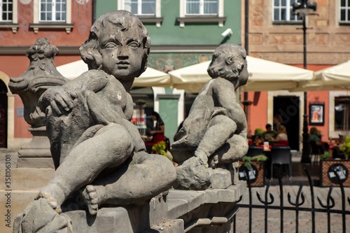 The boy statues at Fontanna Prozerpiny w Poznaniu, the fountain at the Stary Rynek town square.