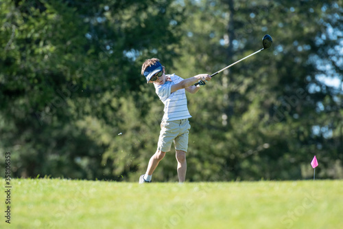 Kid hitting a driver