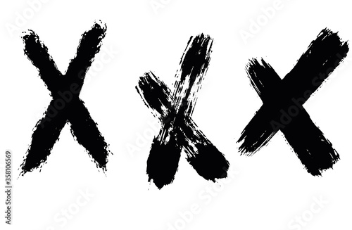 Set of crosses in grunge style. Paint strokes with a dry brush