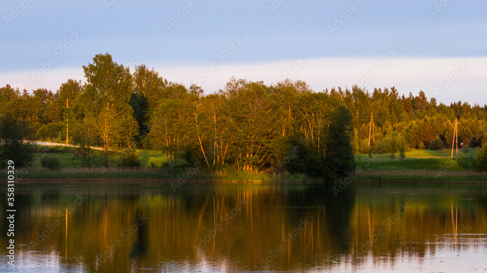 lake shore with  fog at sunset