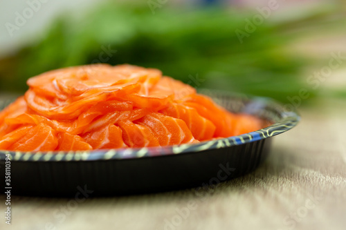 sliced raw salmon in dish